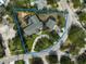 Aerial view of a property that has a pool with the property line in blue at 105 Island Cir, Sarasota, FL 34242