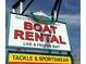Sign advertising boat rentals, live and frozen bait, tackle, and sportswear for all your boating and fishing needs at 105 Island Cir, Sarasota, FL 34242