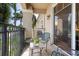 Charming balcony featuring outdoor seating and a wrought iron railing overlooking greenery at 1064 N Tamiami Trl # 1133, Sarasota, FL 34236
