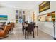 Dining area with stylish lighting fixtures, and elegant dining table at 1064 N Tamiami Trl # 1133, Sarasota, FL 34236