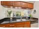 Kitchen featuring stainless steel appliances, granite countertops, and a convenient breakfast bar at 1064 N Tamiami Trl # 1133, Sarasota, FL 34236