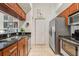 Efficient kitchen with stainless steel appliances, granite countertops, and ample cabinetry at 1064 N Tamiami Trl # 1133, Sarasota, FL 34236