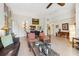 Spacious living room with a tile floor, modern furniture, and neutral paint at 1064 N Tamiami Trl # 1133, Sarasota, FL 34236
