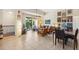 Inviting living room showcasing tile floors, a ceiling fan, and a private balcony at 1064 N Tamiami Trl # 1133, Sarasota, FL 34236