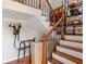 Classic staircase with hardwood treads, iron spindles and natural light at 1064 N Tamiami Trl # 1133, Sarasota, FL 34236