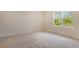 Bedroom featuring neutral carpet, natural lighting and view from a window at 12570 Brookgreen St, Venice, FL 34293