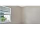 Bedroom features a bright window with horizontal blinds, and neutral colored walls at 12570 Brookgreen St, Venice, FL 34293