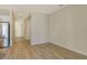 Open concept living room with wood look floors, and neutral walls at 12570 Brookgreen St, Venice, FL 34293