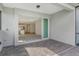 Open patio with brick flooring looking into the home's bright, open-concept living space at 12570 Brookgreen St, Venice, FL 34293