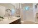 Bathroom featuring a combination shower and tub with white tiled walls and a vanity at 14350 Stirling Dr, Lakewood Ranch, FL 34202