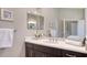 Bright bathroom featuring a well-lit vanity, framed mirror and neutral wall color at 14350 Stirling Dr, Lakewood Ranch, FL 34202
