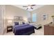 Bedroom featuring two beds, ceiling fan, neutral colors and coordinated decor at 14350 Stirling Dr, Lakewood Ranch, FL 34202