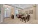 Inviting dining area featuring an elegant mirror wall and tasteful decor, creating an atmosphere of refined dining at 14350 Stirling Dr, Lakewood Ranch, FL 34202