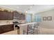 Well-equipped kitchen with stainless steel appliances and a breakfast bar at 14350 Stirling Dr, Lakewood Ranch, FL 34202