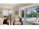 Screened-in lanai with pool views, outdoor seating, and lush landscaping at 14350 Stirling Dr, Lakewood Ranch, FL 34202