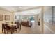 Open-concept living area features tile flooring, dining space, and views of the outdoor pool at 14350 Stirling Dr, Lakewood Ranch, FL 34202
