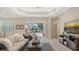 Bright living room with pool view, sliding glass doors, and comfortable seating at 14350 Stirling Dr, Lakewood Ranch, FL 34202