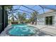 Screened-in pool area features sun deck with patio seating and lush landscaping at 14350 Stirling Dr, Lakewood Ranch, FL 34202