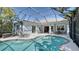 Inviting pool area with sun deck, patio seating and tranquil views at 14350 Stirling Dr, Lakewood Ranch, FL 34202
