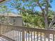 Balcony view of lush green trees and building, providing a serene and private outdoor space at 1493 Landings Lake Dr # 32, Sarasota, FL 34231