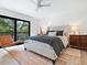 Comfortable bedroom featuring a large window, ceiling fan, and stylish furnishings at 1493 Landings Lake Dr # 32, Sarasota, FL 34231