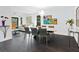 Open-concept dining area boasts modern decor, a stylish table and chairs, and ample natural light at 1493 Landings Lake Dr # 32, Sarasota, FL 34231