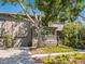 Lovely home exterior featuring a driveway and front entrance with verdant landscaping at 1493 Gulf Of Mexico Dr #312, Longboat Key, FL at 1493 Landings Lake Dr # 32, Sarasota, FL 34231