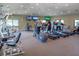 Fitness center featuring treadmills, elliptical machines, weight machines, and TVs for community residents at 1493 Landings Lake Dr # 32, Sarasota, FL 34231