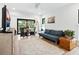 Bright living room with plush rug, modern seating, and access to outdoor living space at 1493 Landings Lake Dr # 32, Sarasota, FL 34231
