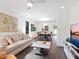 Spacious living area featuring modern furnishings, a flat-screen TV, and a dining area at 1493 Landings Lake Dr # 32, Sarasota, FL 34231