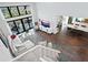 Open-concept living space with staircase, glass railing, and views of the living and dining areas at 1493 Landings Lake Dr # 32, Sarasota, FL 34231