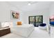 Spacious main bedroom featuring plush carpet, modern decor, and a balcony with lush outdoor views at 1493 Landings Lake Dr # 32, Sarasota, FL 34231