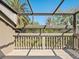 View of the screened in porch with palm trees at 1493 Landings Lake Dr # 32, Sarasota, FL 34231
