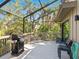 Screened in porch with table and grill at 1493 Landings Lake Dr # 32, Sarasota, FL 34231