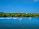 Boat and jet skis on the water. Recreational water activities at 1493 Landings Lake Dr # 32, Sarasota, FL 34231