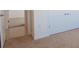 Carpeted bedroom with white door leading to the bathroom and the white closet with silver handles at 15543 Trinity Fall Way, Bradenton, FL 34212