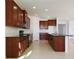 Spacious kitchen with a center island, stainless steel appliances, and plenty of cabinet storage at 15543 Trinity Fall Way, Bradenton, FL 34212
