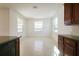Versatile living space featuring tile floors, a breakfast bar, lots of windows, and natural light at 15543 Trinity Fall Way, Bradenton, FL 34212
