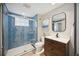 Bathroom with a tiled glass shower, and a modern vanity with drawers for storage and a framed mirror at 1586 Dorgali Dr, Sarasota, FL 34238