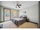 Neutral bedroom with gray furnishings, a door to the exterior, and a ceiling fan at 1586 Dorgali Dr, Sarasota, FL 34238
