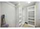 Walk-in closet with shelving and hanging rods providing ample storage space at 1586 Dorgali Dr, Sarasota, FL 34238