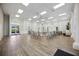 Spacious clubhouse featuring elegant seating, wood floors, and abundant natural light at 1586 Dorgali Dr, Sarasota, FL 34238