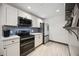 Well-equipped kitchen with stainless steel appliances and ample cabinet space at 1586 Dorgali Dr, Sarasota, FL 34238