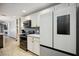 Modern kitchen with white cabinets, stainless steel appliances, and stylish finishes at 1586 Dorgali Dr, Sarasota, FL 34238