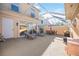 Screened in patio featuring two lounge chairs, an outdoor table, and grill at 1586 Dorgali Dr, Sarasota, FL 34238