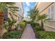 Beautiful walkway between homes with lush landscaping and privacy at 1586 Dorgali Dr, Sarasota, FL 34238