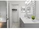 Stylish bathroom featuring gray vanity, granite countertop, and tiled floor at 18106 Canal Pointe St, Tampa, FL 33647