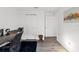 Cozy bedroom featuring modern wood floors, fresh white walls, and a modern desk at 18106 Canal Pointe St, Tampa, FL 33647