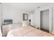 Well-lit bedroom with wood floors, a dresser, and a comfortable pink bed at 18106 Canal Pointe St, Tampa, FL 33647