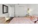 Relaxing bedroom featuring wood floors and a comfortable pink bed at 18106 Canal Pointe St, Tampa, FL 33647